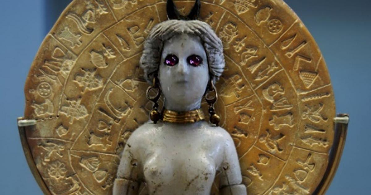 Side B of the Enigmatic Phaistos Disc. Figurine of goddess Astarte with horned headdress 