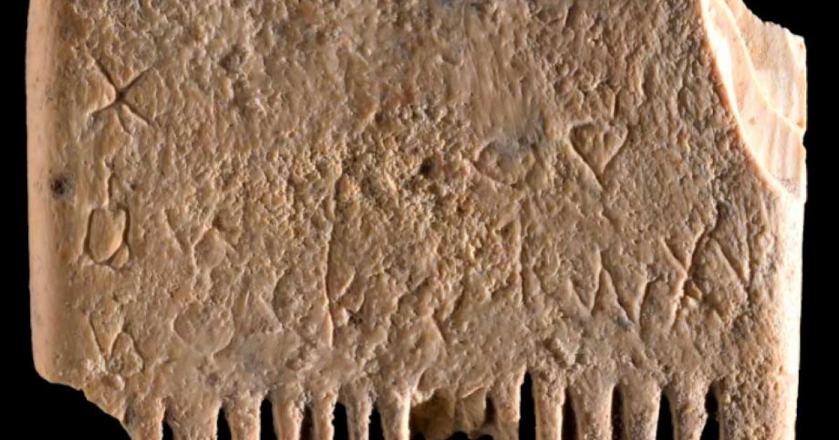First Canaanite writing scratched onto an ivory comb. Source: Dafna Gazit/Israel Antiquities Authority