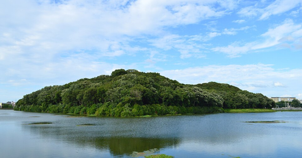 Forested Kofun burial mound surrounded by a moat