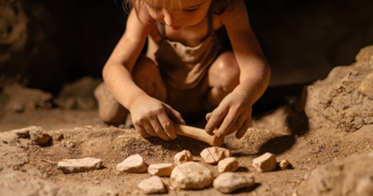 Representative image of Neanderthal child playing with a collection of stones.