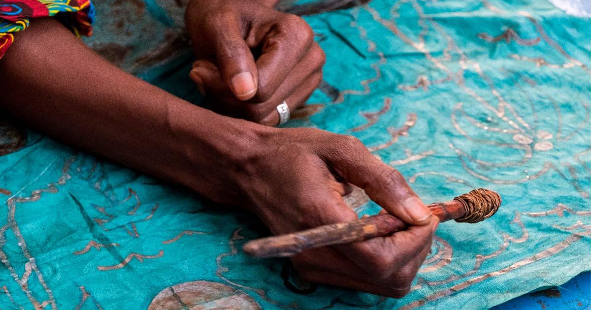Decorating fabric in Gambia. Source:  s-aznar / Adobe Stock.