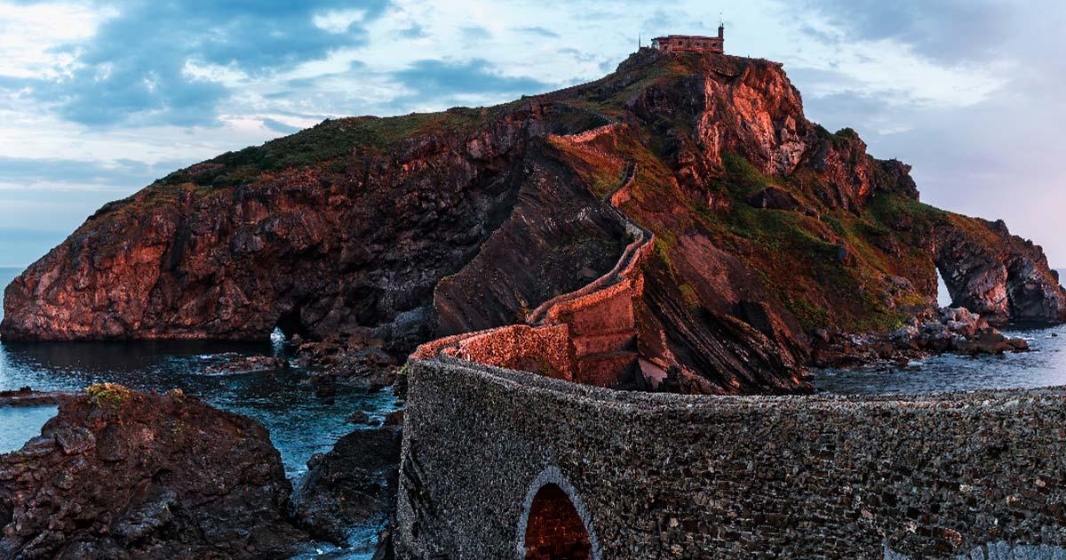 Sunrise on the San Juan de Gaztelugatxe Island, Spain. Source: samael334/Adobe Stock