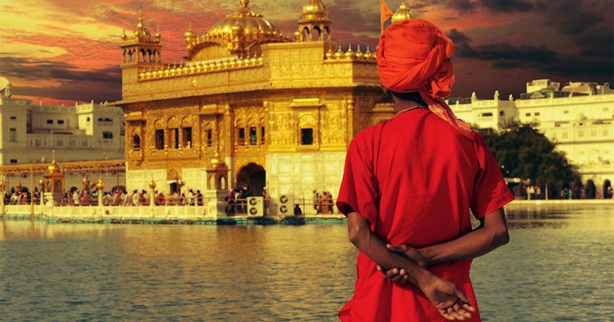 Pilgrim at the golden temple in the city of Amritsar-India, main temple of Sikhs, during sunset.            Source: MICHEL / Adobe Stock