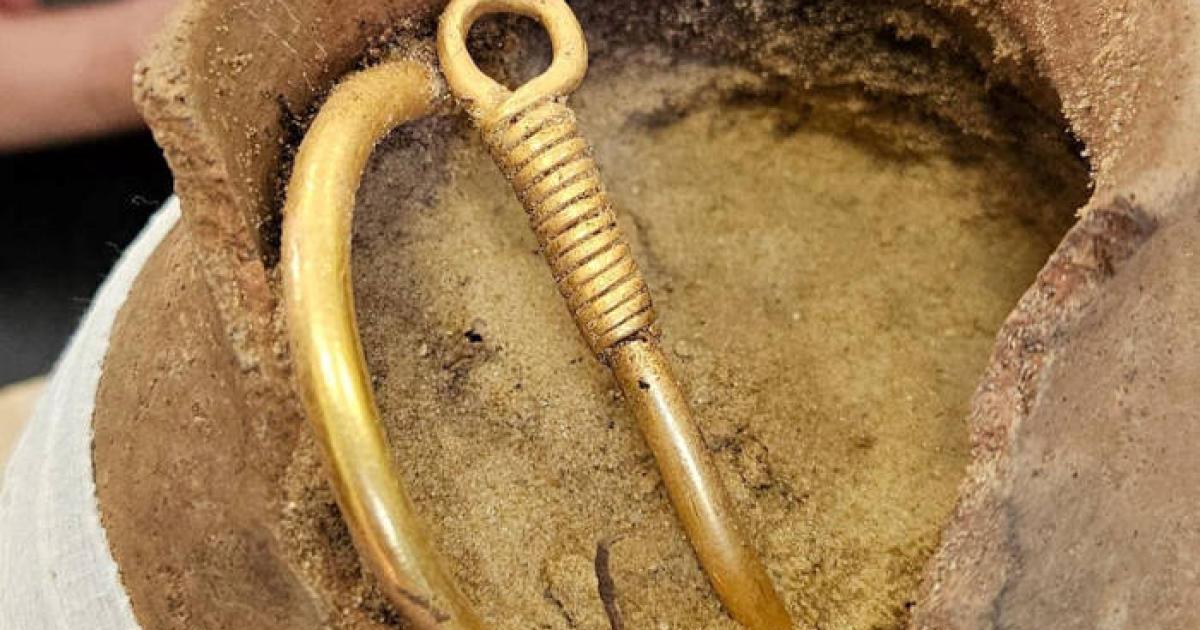  Gothic gold necklace in the clay pot in which it was found.