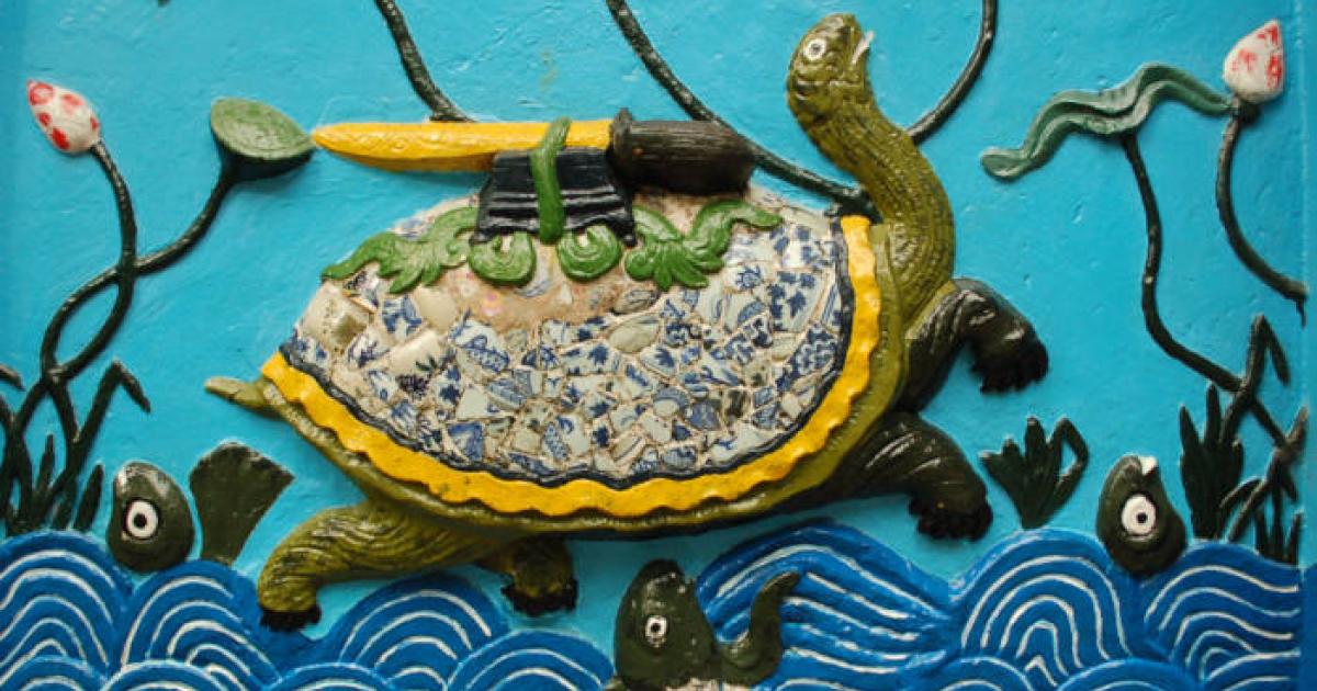 Ceramic artwork depicting Kim Quy and the Restored (or Returned) Sword. 