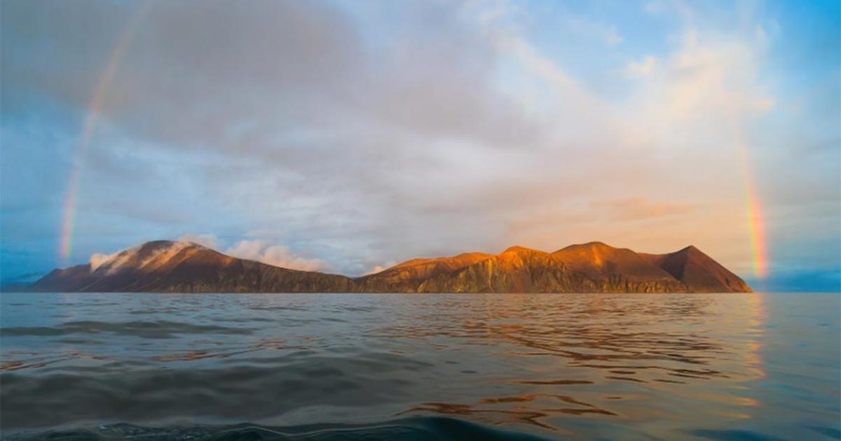Beautiful panorama with a rainbow over the sea and the coast. The amazing nature of the Arctic. Picturesque northern landscape. Providence Bay, Bering Sea, Pacific Ocean. Chukotka, Far East of Russia   Source: Andrei Stepanov / Adobe Stock