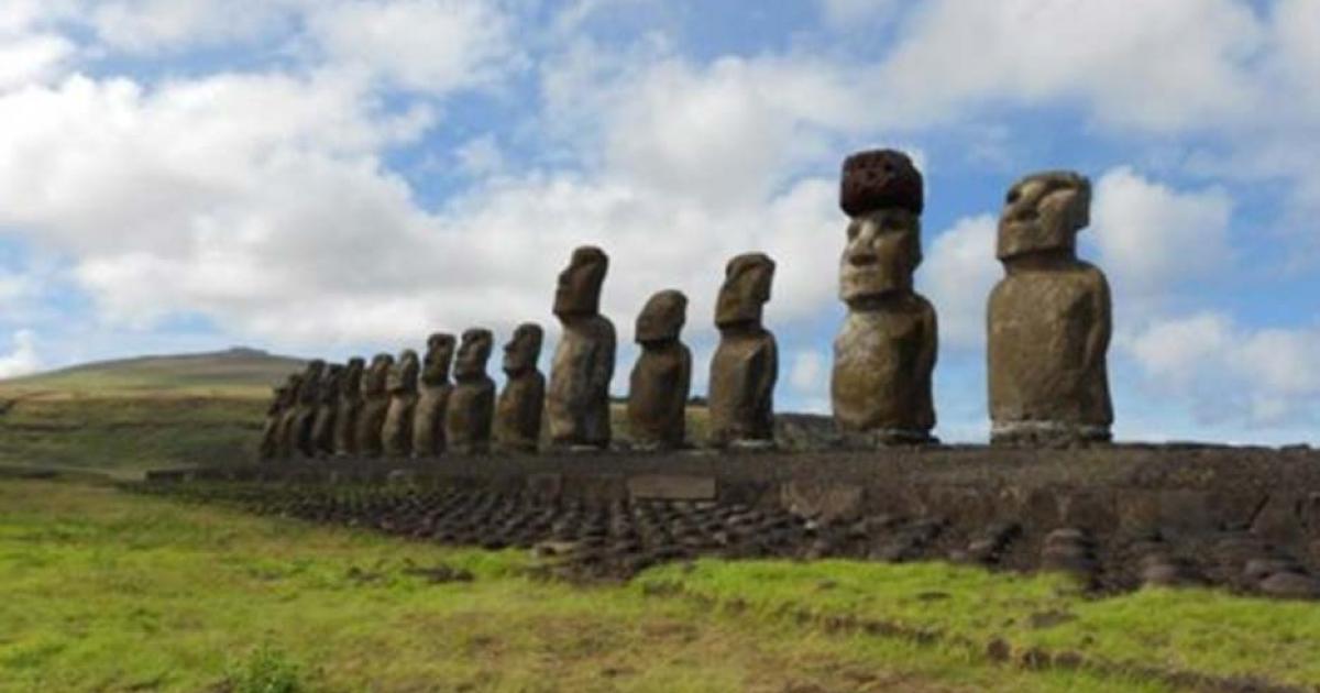 Restored statue platform with standing moai on the south coast of Rapa Nui. Note that one of the moai is adorned with a red scoria pukao. 