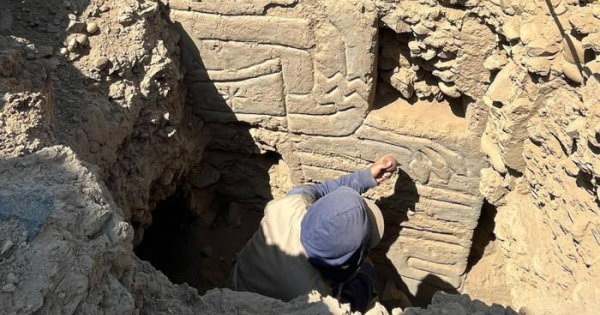 Archaeologist investigating the 3D polychrome mural 
