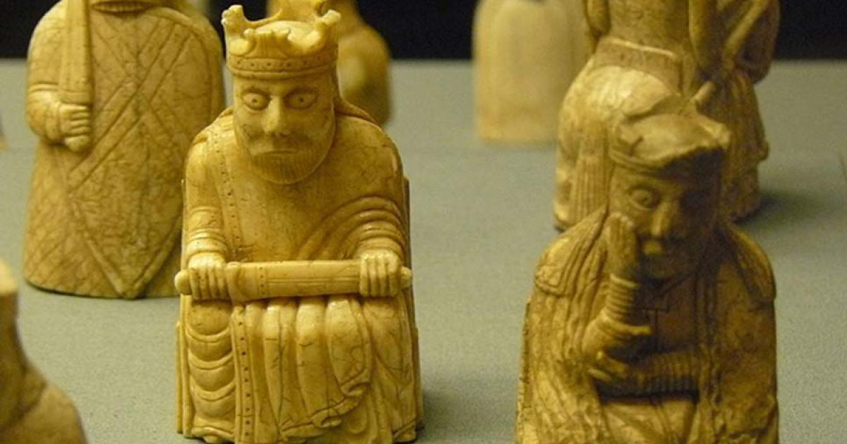 Lewis Chessmen king and queen, with rook and knight behind them.