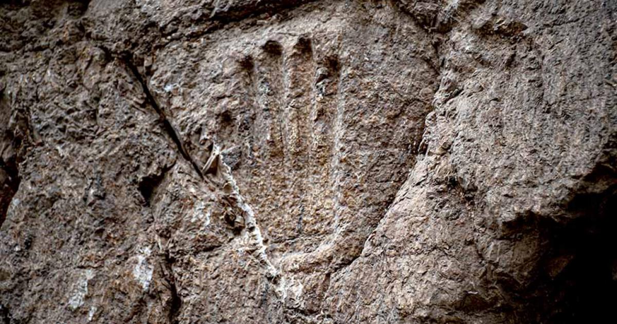 The mystery handprint was discovered on an ancient moat wall in the Old City of Jerusalem. Source: Yuli Schwartz / Israel Antiquities Authority