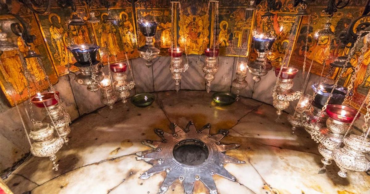 A silver star marks the traditional site Jesus' birthplace in a grotto underneath Bethlehem's Church of the Nativity.       