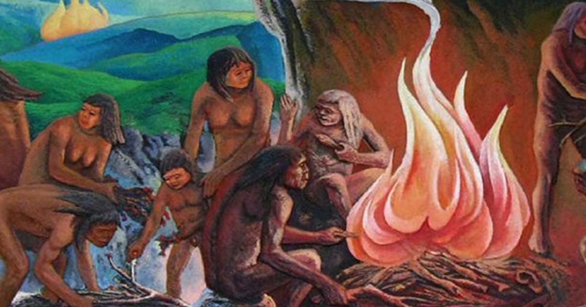 Representation of prehistoric people around a campfire.