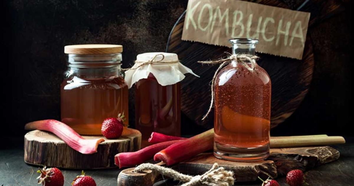 Homemade fermented raw kombucha tea with different flavorings. Source: sveta_zarzamora / Adobe.