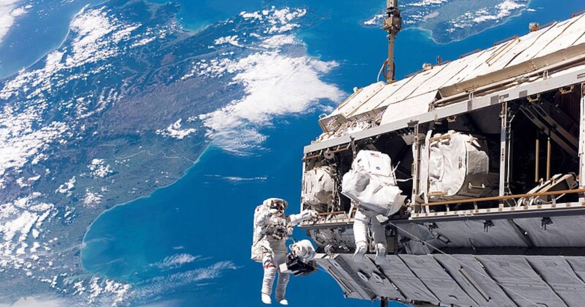 View from the International Space Station, looking down at a blue and fertile Earth where life has blossomed.