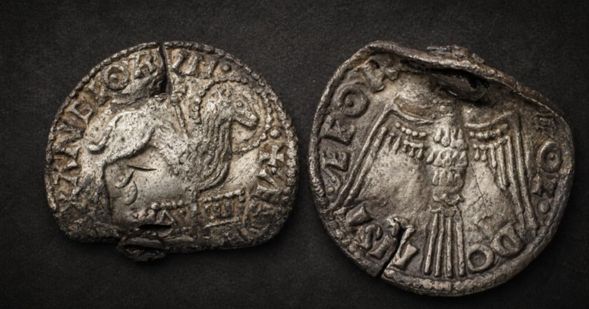 Obverse and reverse of the rare Anglo-Saxon Agnus Dei coin: the front shows the Lamb of God pierced by a cross and standing above the Alpha and Omega, while the reverse features the Holy Spirit dove.