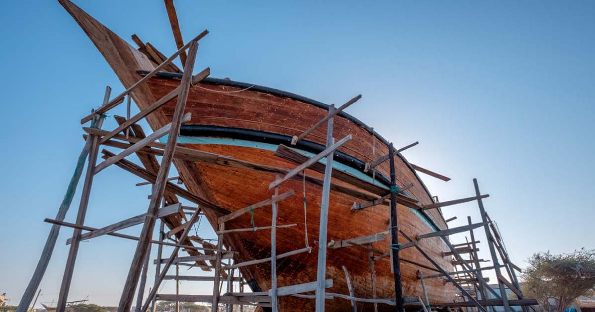 Traditional Lenj boat building on Qeshm Island, Iran. Source: Gone For A Drive. / Adobe Stock.