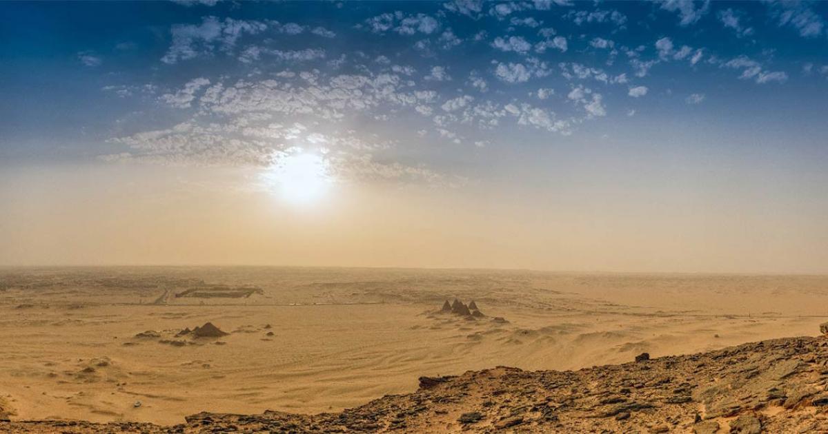 Archaeological site Jabal Maragha in Sudan has been destroyed by industrial-scale looting. Illustrative image from Jebel Bakal across the Sudanese desert with the pyramids. Source: Frank / Adobe Stock