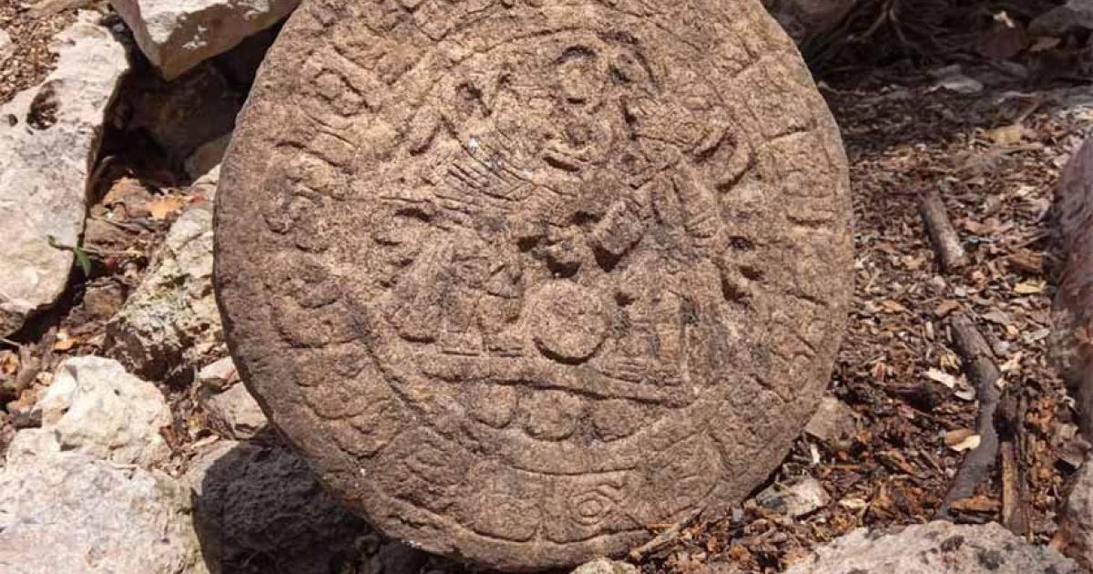 Archaeologists unearthed a stone commemorative disc featuring images of contestants in a Maya ball game at Chichén Itzá in Mexico. Source: INAH