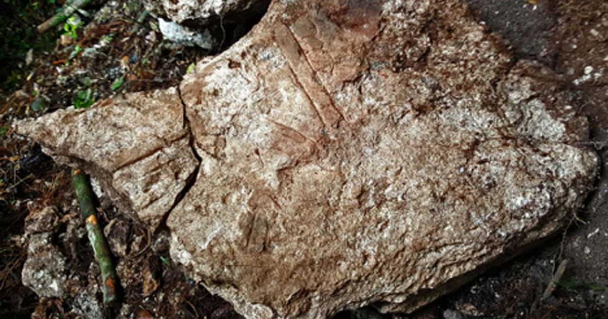 Inscribed stone from a monument at Witzna with scorching dated to 697.      Source: Francisco Estrada-Belli / Nature Magazine