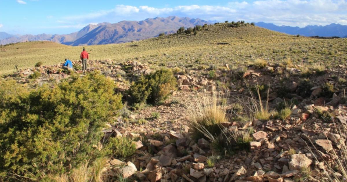 Expedition members amid the stone structures at the archaeological site in the Cordillera del Tigre, Mendoza