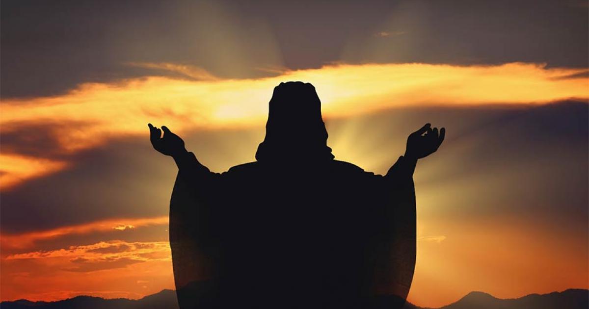 Silhouette Jesus in the sunset. Source: artphotoclub / Adobe Stock