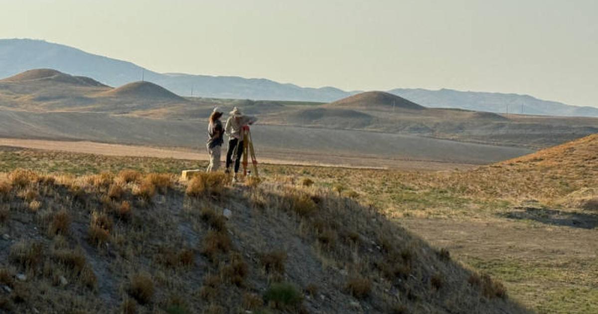 The researchers studying the mounds near the citadel of Gordion, Turkey.