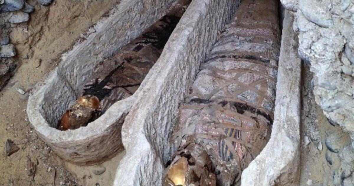 Mummies in sarcophagi at Al-Bahnasa, Egypt.
