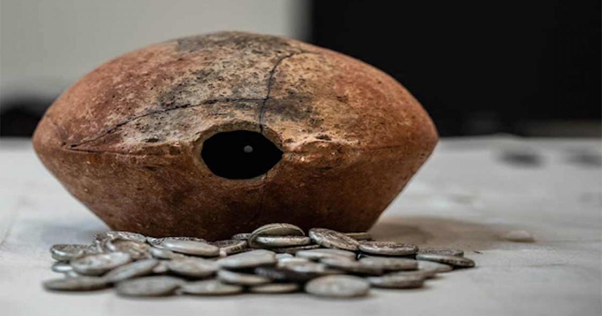 The 300-BC Mleiha silver coin hoard and the ancient jar it was found in. Source: Sharjah Archaeology Authority