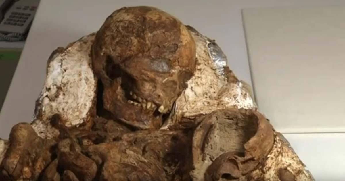 The Stone Age remains of a mother cradling her baby.