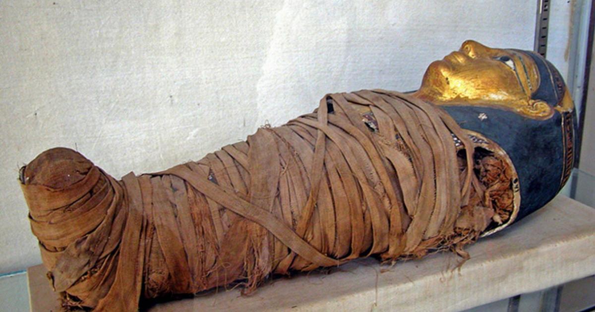 Mummy of a child with a gilded face mask. Greco-Roman Museum, Alexandria, Egypt. Representational image only.