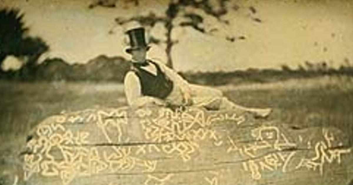 An 1853 reversed image of Seth Eastman (known for documenting Native American life in the 1800s) on top of the boulder known as Dighton Rock.