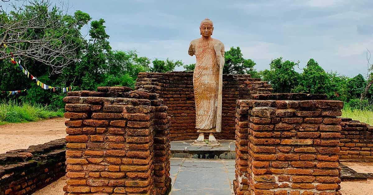 An ancient Buddhist statue (a replica) amidst the ruins of a rescued Buddhist monastery at Nagarjunakonda, India.     Source: Ms Sarah Welch / CC0