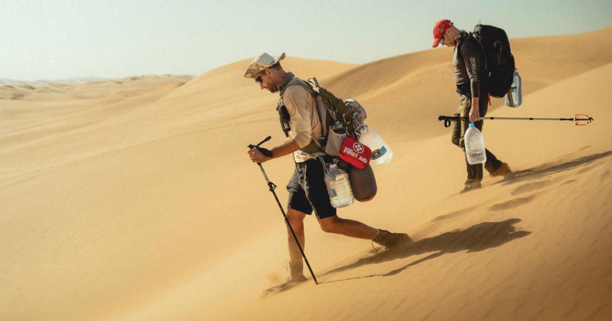 Professor Dominic Stratford and Dr George Leader, trekking the Namib desert.