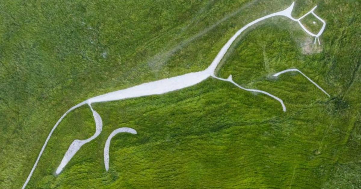 ational Trust Uffington White Horse after a phase of refurbishment where erosion and bad weather have caused shrinkage of the Bronze Age chalk carving over the decades. The artwork measures 111-metres long from head to tail and depicts a white horse near the Oxfordshire village of Uffington. Source: BBC/ PA Media