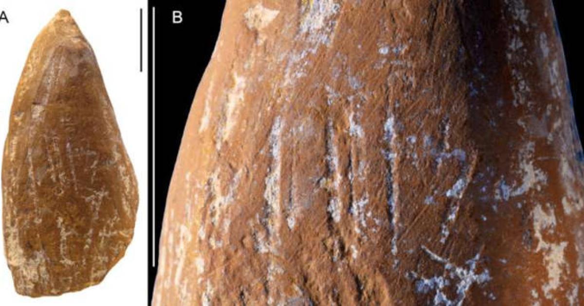 Scraped and ground ochre crayon showing deliberate modification.