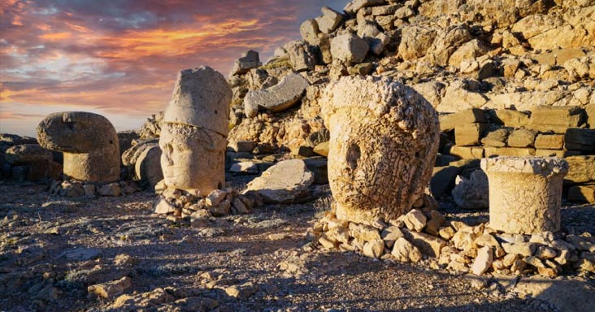Nemrut Mountain at 2150 meters with colossal statues, and stone heads. A UNESCO World Heritage site. Anatolia, modern day Turkey. 	Source: Bulent/Adobe Stock