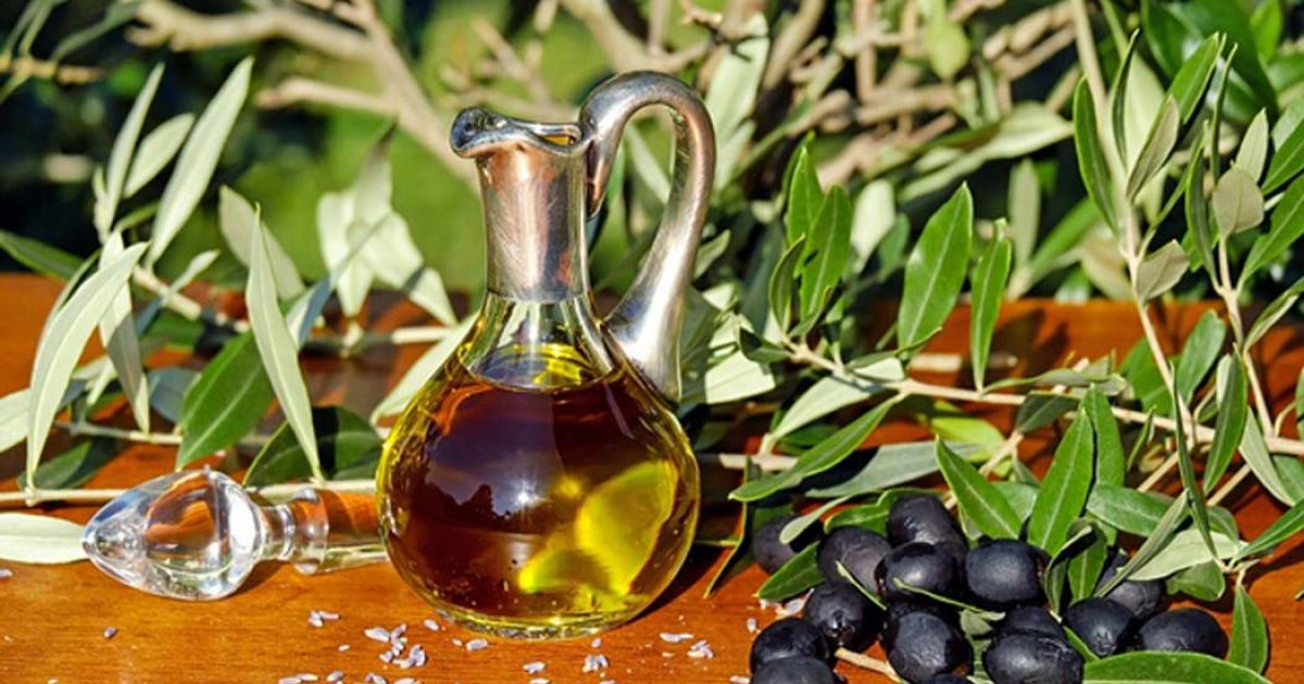 Modern glass carafe of olive oil. 