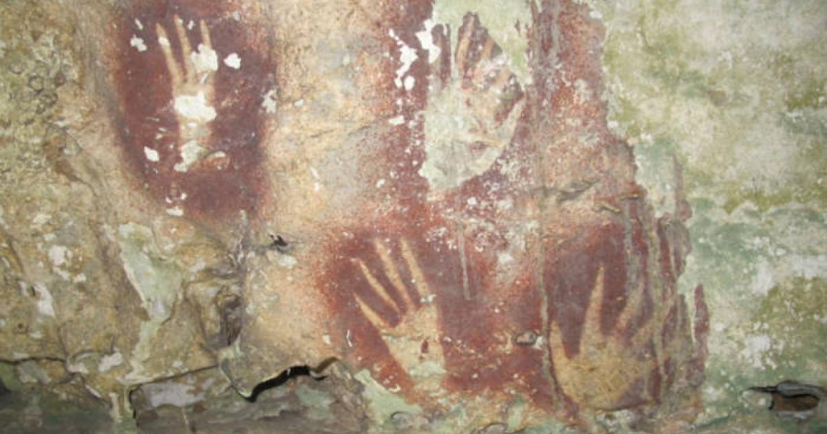 Hand print art in red found in a Sulawesi cave.