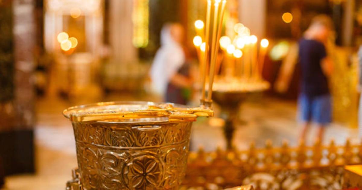Chalice for olive oil in a religious setting.