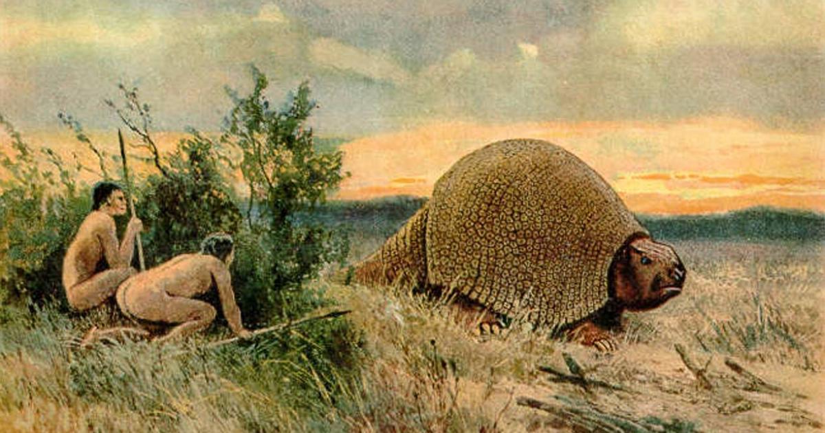 Paleolithic man (Paleoindians) hunting a glyptodon – ancient ancestor to the armadillo. (Illustration 1920) Did these societies use poison to bring down their prey? 
