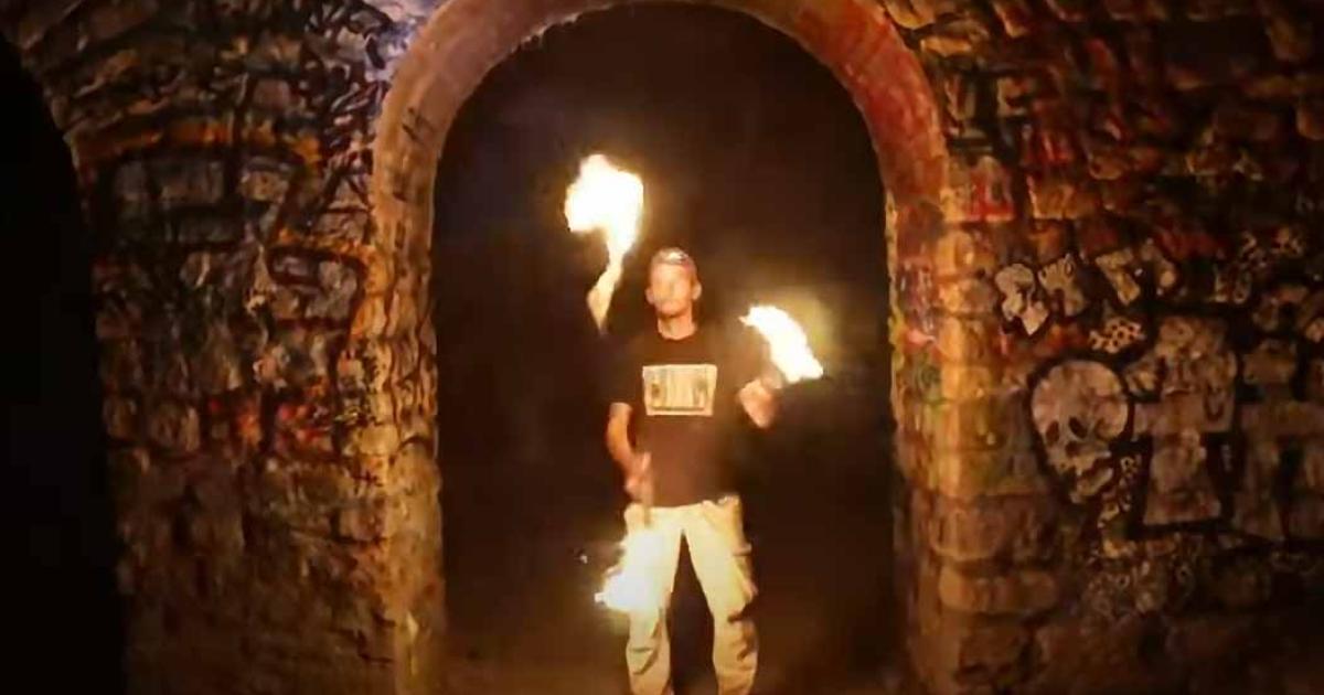 A ‘cataphile’ inside the Paris catacombs. Source: YouTube Screenshot / The New York Times.