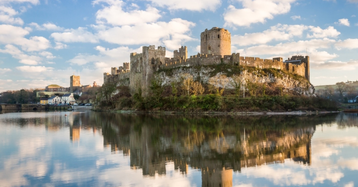 Pembroke Castle in Pembrokeshire, Wales. Archaeologists from the University of Aberdeen are excavating Wogan Cavern beneath the medieval fortress, where preserved sediments contain evidence of human occupation and environmental change stretching back more than 100,000 years