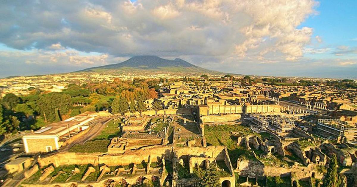 Ruins of Pompeii seen from the above with a drone, with the Vesuvius in the background 