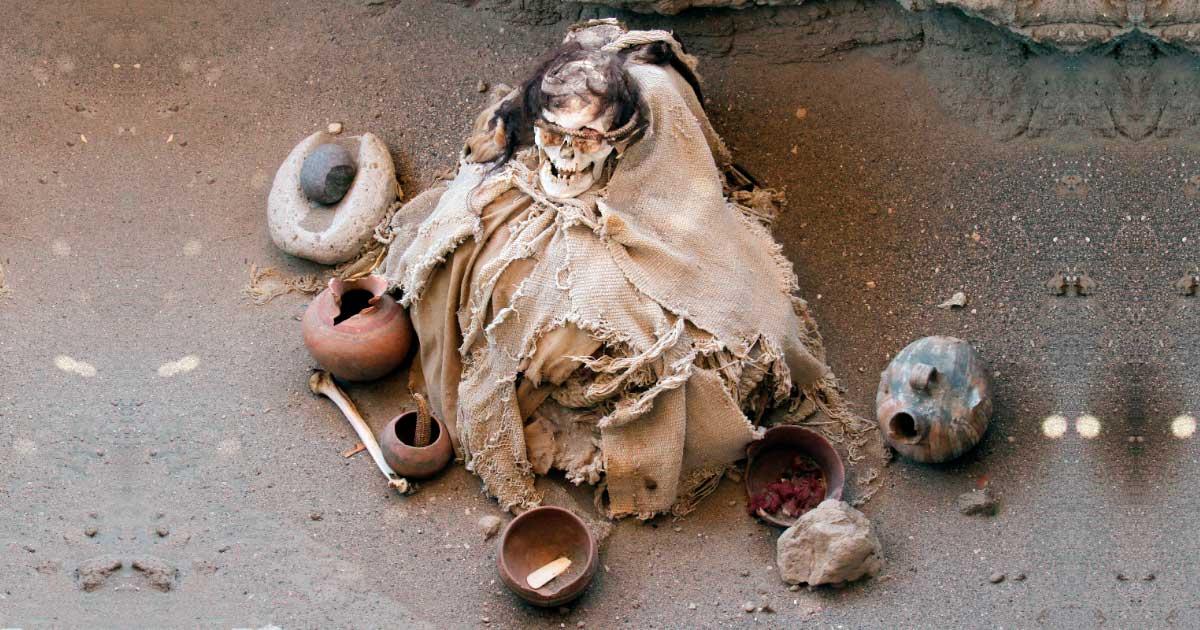 A mummified individual discovered in Chauchilla, Nazca, Peru, with traditional pre-Columbian burial dress and goods. One of the recently discovered mummies was holding a cross, supporting an estimated date in the colonial period. Source: Gerardo Daniel / Adobe Stock