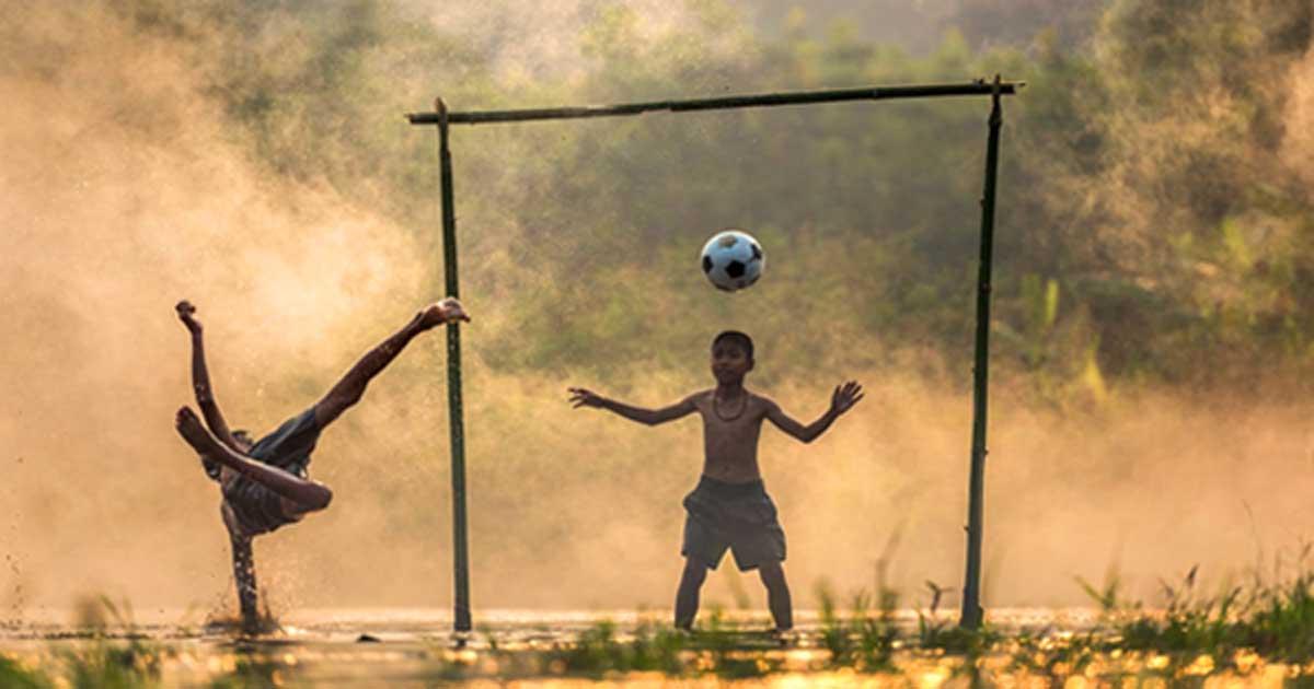 Children playing football in Thailand