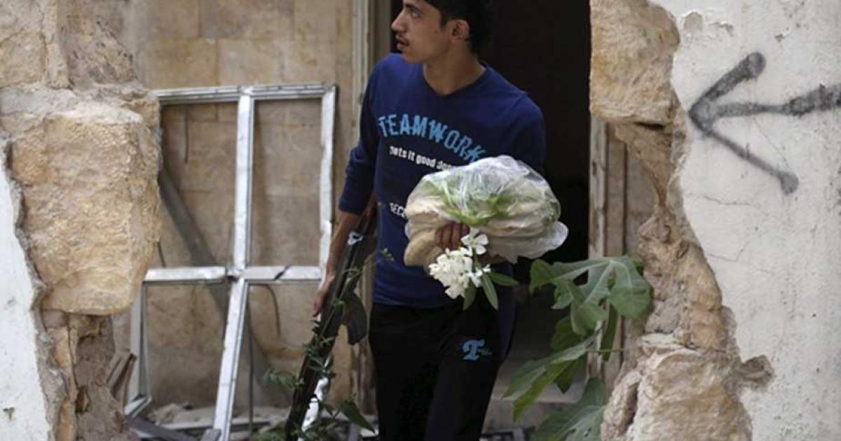 A rebel fighter in Aleppo’s Al-Ezaa neighborhood. Credit: Hosom Katan
