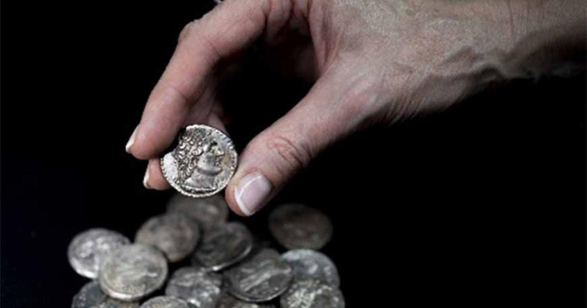 The hoard of fifteen tetradrachm were found in a wooden container lined with sheepskin and cloth (Israel Antiquities Authority)