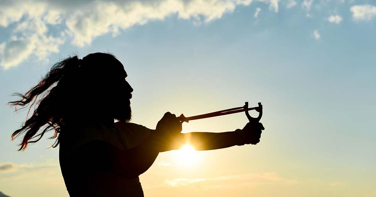 Representational image of man with slingshot. Source: emerald_media / Adobe Stock