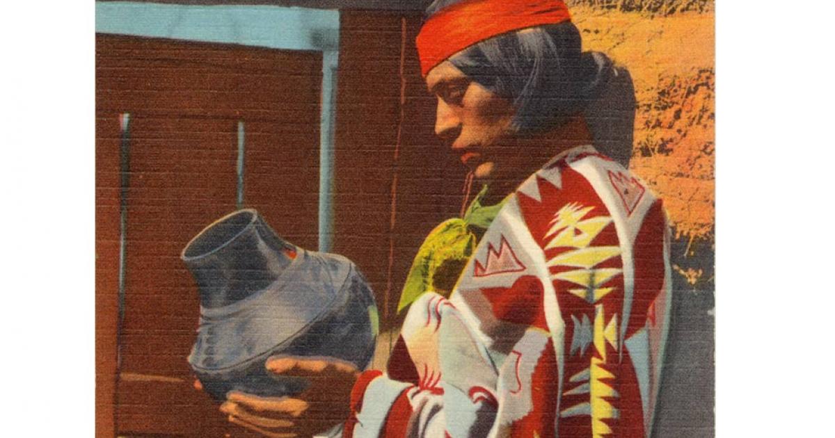 This postcard shows a Pueblo Indian man with San Ildefonso Black Pottery. The postcard was published between 1930 and 1945. 