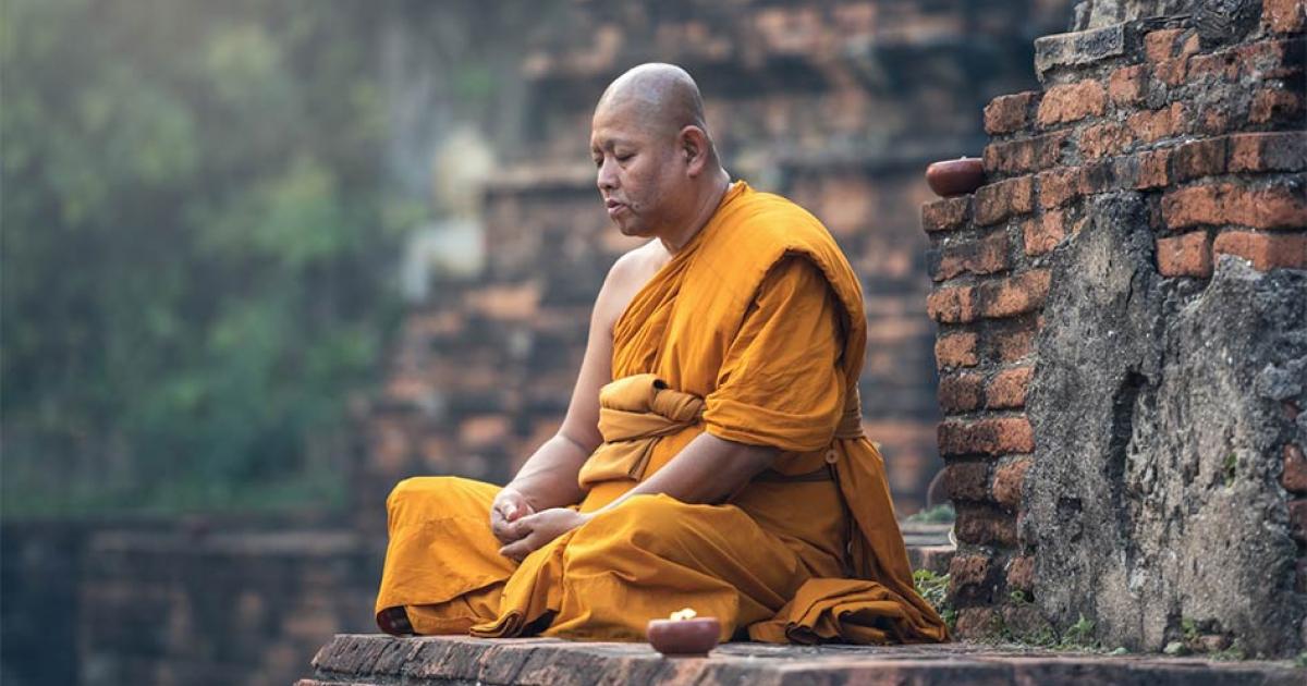 Buddhist monk meditation in temple             Source: Sasint / Adobe Stock